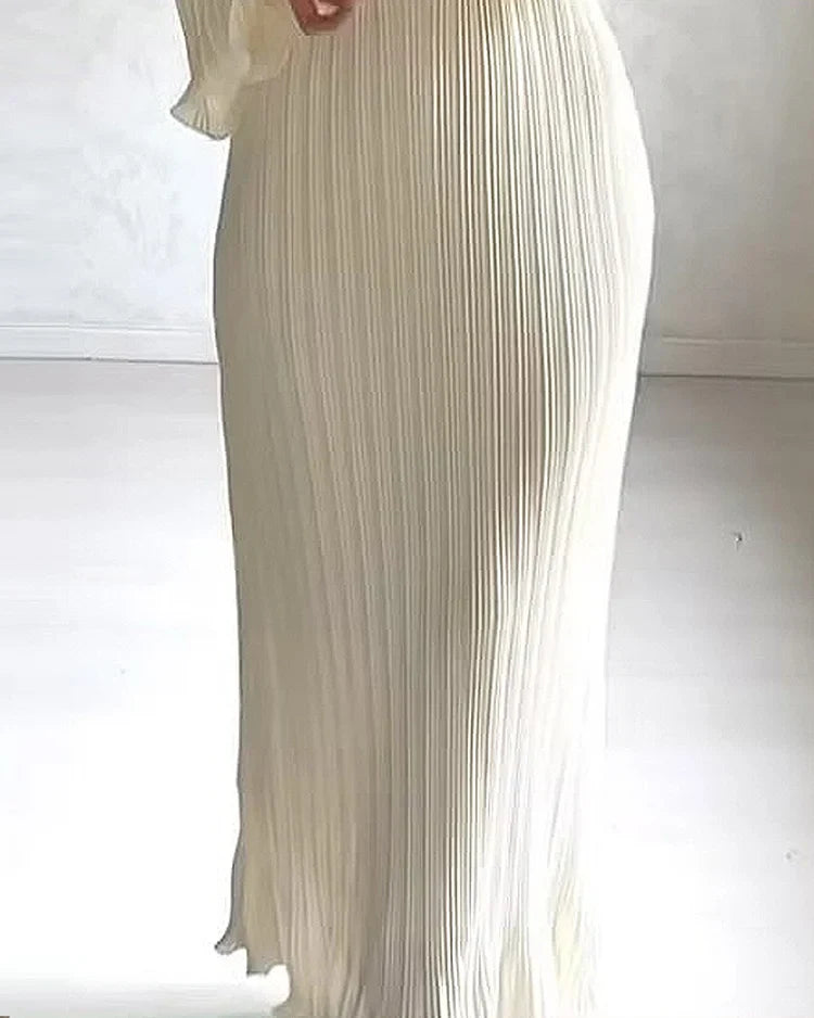 Maxi-Jurk Met Plisséstructuur En Golvende Mouwen – Puur Minimalisme Met Sierlijke Details
