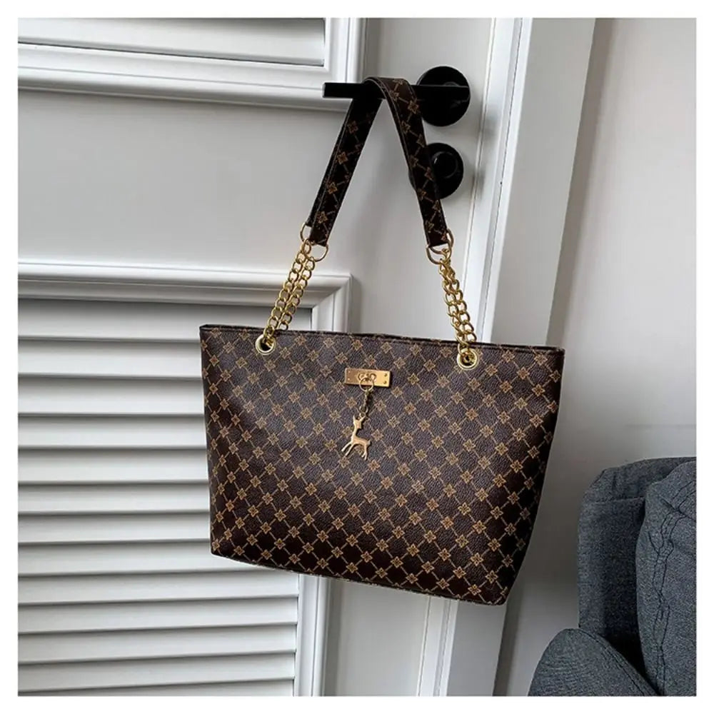 Luxe schoudertas voor dames – elegant patroon, gouden kettinghengsels & ruime indeling