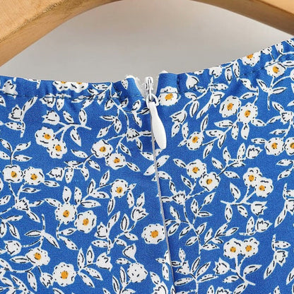 Bloemenprint Wikkeljurk Met V-Hals En Rufflezoom – Zomerse Charme In Een Speels Design